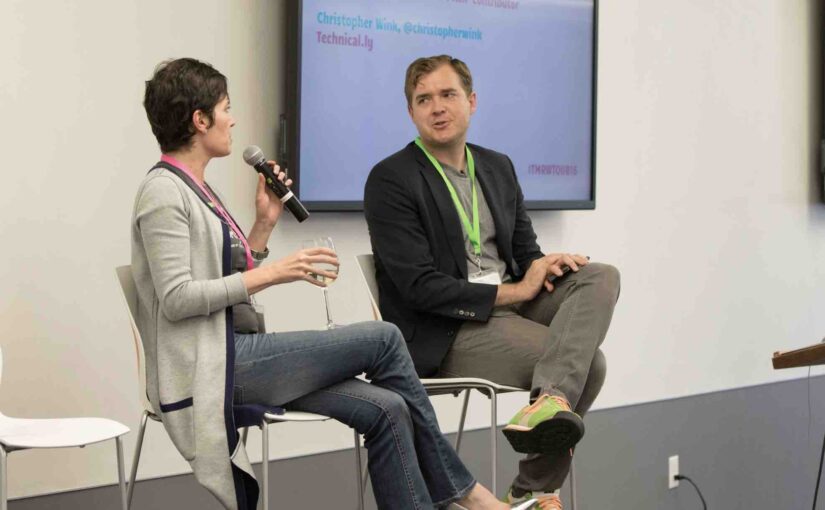 woman being interviewed by man