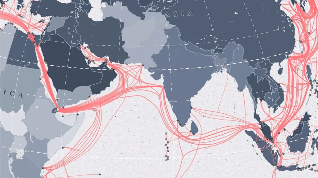Blueish map of the world with red lines mapping undersea cables